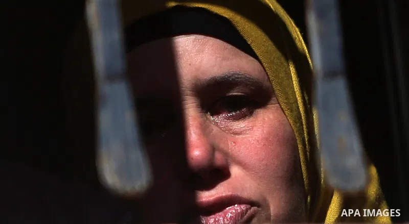 A relative of Palestinian Maen Nasser al-Din Abu Qaraa, 23, mourns during his funeral after Israel released his body, in the West Bank city of Ramallah, on December 31, 2016. Abu Qaraa was killed by Israeli forces on Nov...