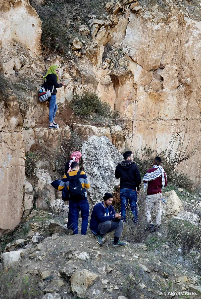 Palestinians take part in the walking tour titled "eyes Tavouh" in the village of Tavouh in the northwest the West bank city of Hebron on the December 31, 2016. Photo by Wisam Hashlamoun