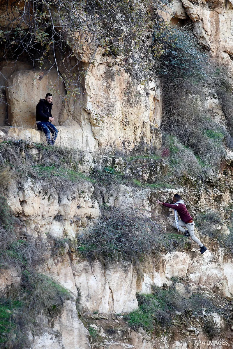 Palestinians take part in the walking tour titled "eyes Tavouh" in the village of Tavouh in the northwest the West bank city of Hebron on the December 31, 2016. Photo by Wisam Hashlamoun