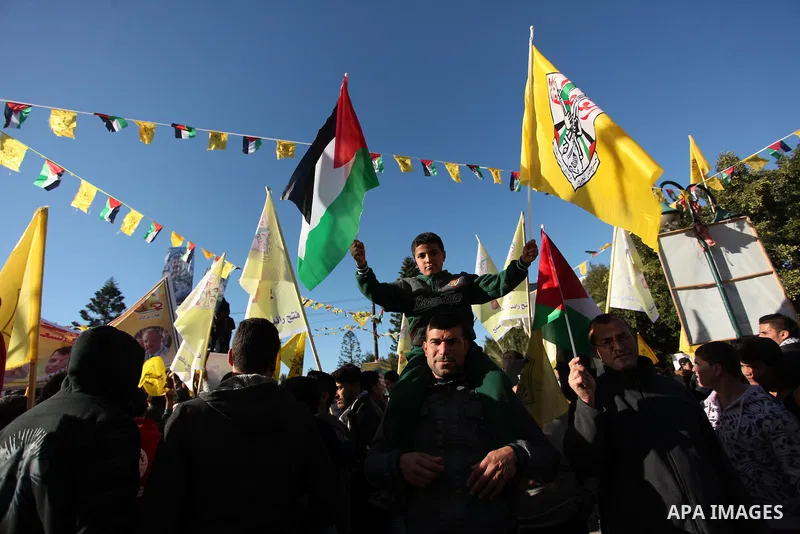 Supporters of the Fatah movement take part in a rally in Gaza City on December 31, 2016, marking the 52nd anniversary of its creation.. Photo by Ashraf Amra