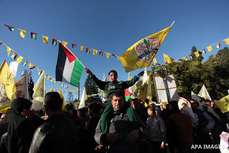 Supporters of the Fatah movement take part in a rally in Gaza City on December 31, 2016, marking the 52nd anniversary of its creation.. Photo by Ashraf Amra