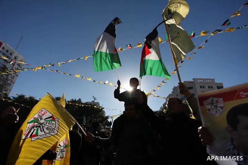 Supporters of the Fatah movement take part in a rally in Gaza City on December 31, 2016, marking the 52nd anniversary of its creation.. Photo by Ashraf Amra