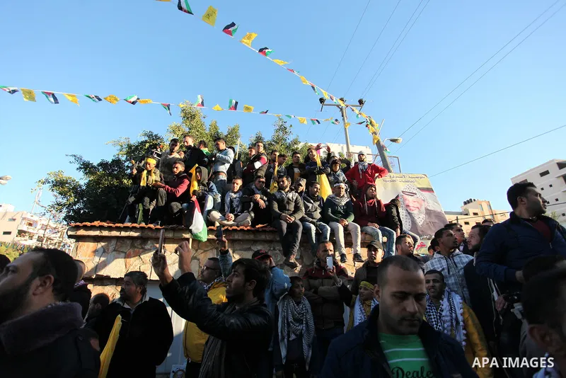 Supporters of the Fatah movement take part in a rally in Gaza City on December 31, 2016, marking the 52nd anniversary of its creation.. Photo by Ashraf Amra