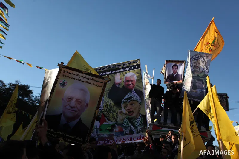 Supporters of the Fatah movement take part in a rally in Gaza City on December 31, 2016, marking the 52nd anniversary of its creation.. Photo by Ashraf Amra