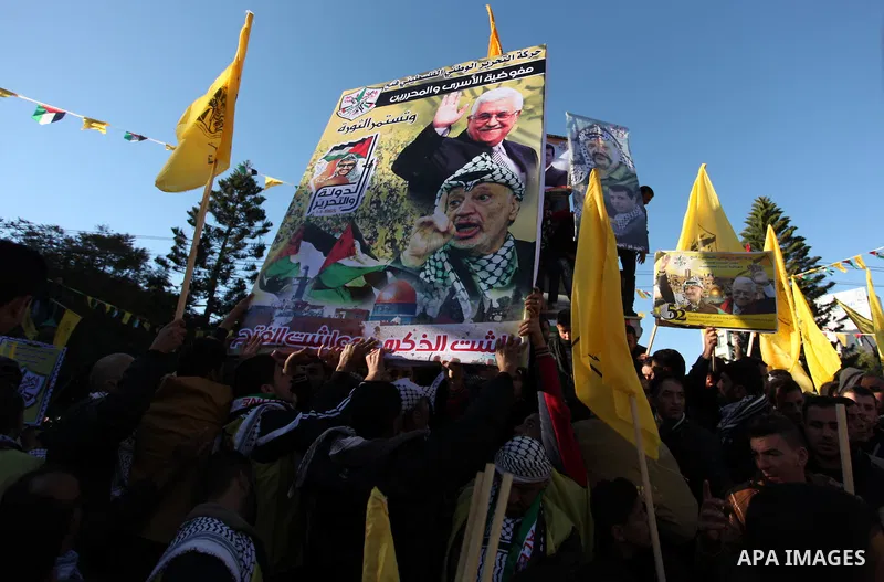 Supporters of the Fatah movement take part in a rally in Gaza City on December 31, 2016, marking the 52nd anniversary of its creation.. Photo by Ashraf Amra