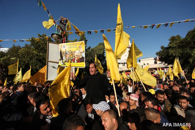 Supporters of the Fatah movement take part in a rally in Gaza City on December 31, 2016, marking the 52nd anniversary of its creation.. Photo by Ashraf Amra