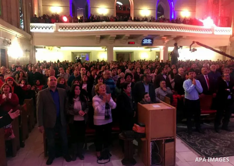 Egyptian Christians attend a religious mass at the Kasr El Dobara Evangelical Church to celebrate New year in Cairo, Egypt on December 31, 2016. Photo by Stringer