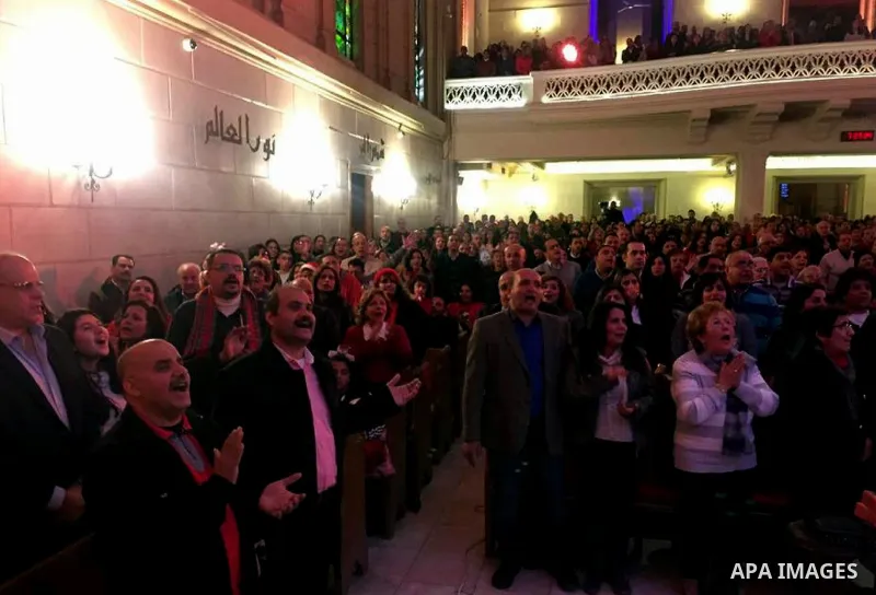 Egyptian Christians attend a religious mass at the Kasr El Dobara Evangelical Church to celebrate New year in Cairo, Egypt on December 31, 2016. Photo by Stringer