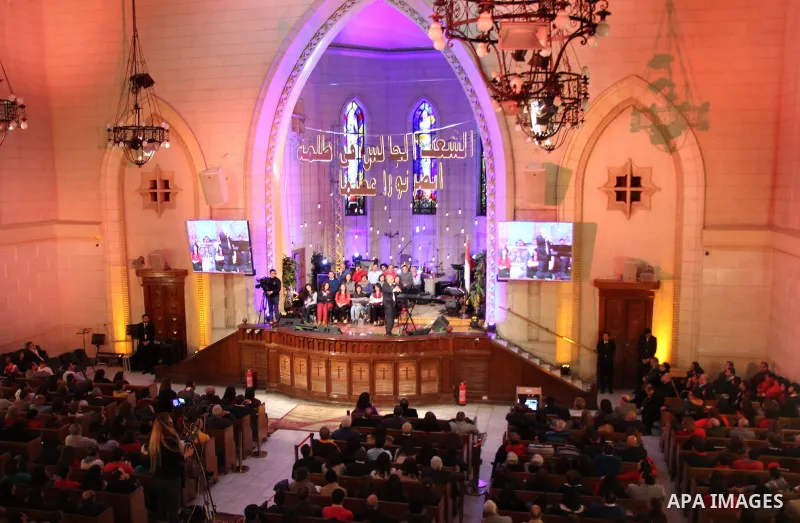 Egyptian Christians attend a religious mass at the Kasr El Dobara Evangelical Church to celebrate New year in Cairo, Egypt on December 31, 2016. Photo by Stringer