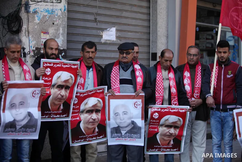 Palestinian supporters of the Popular Front for the Liberation of Palestine (PFLP), take part during a protest to show solidarity with Palestinian prisoners in Israeli jails, in Gaza city on January 4, 2017. Photo by Ash...