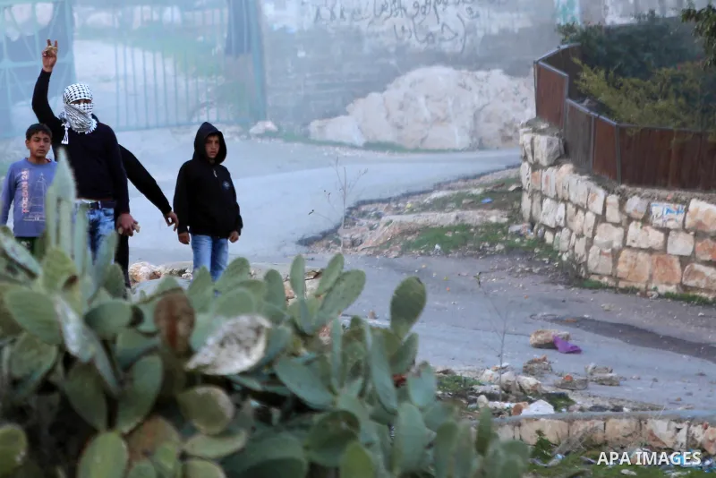 Palestinian protesters clash with Israeli security forces after attempt to demolish house which Israeli authorities said it was built without a permit, in the occupied West Bank village of Budrus near Ramallah on January...