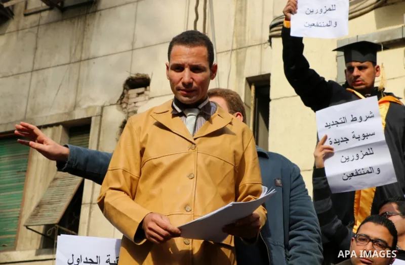 Egyptian lawyers hold placards during a protest against lawyers Syndicate head Sameh Ashour, in front of the syndicate lawyers, Cairo, Egypt, on January 05, 2017. Photo by Amr Sayed