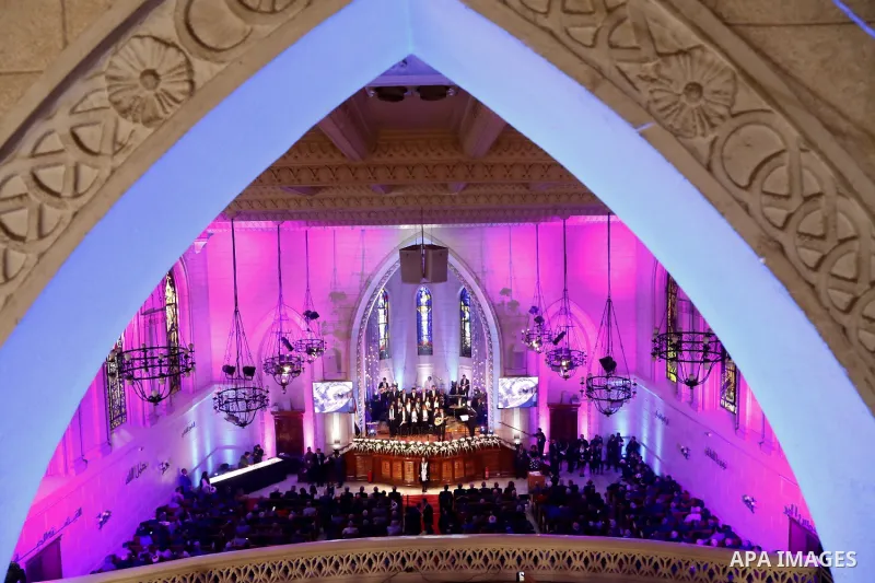 Egyptian Christians take part in a prayer during celebrations of Christmas Eve according to the Eastern Orthodox calendar, at the Kasr el Dobara Evangelical Church, in Cairo, Egypt, on January 6, 2017. Photo by Amr Sayed