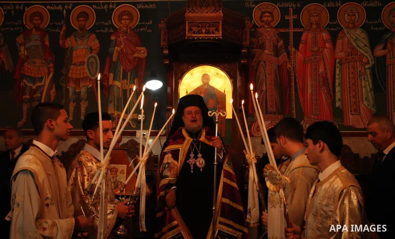 Palestinian Orthodox Christian altar boys attend a Christmas mass at the Saint Porphyrios Greek Orthodox church in Gaza City on January 7, 2017. According to the Gregorian calendar, Orthodox Christmas falls 13 days after...
