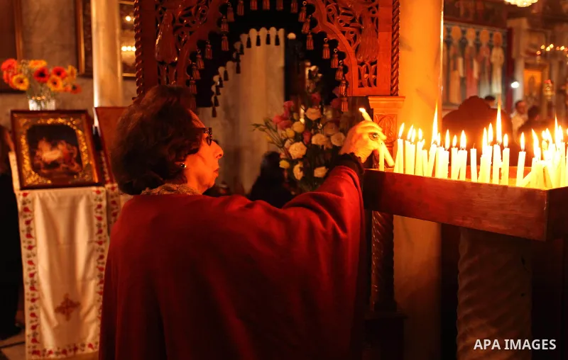 Palestinian Orthodox Christian altar boys attend a Christmas mass at the Saint Porphyrios Greek Orthodox church in Gaza City on January 7, 2017. According to the Gregorian calendar, Orthodox Christmas falls 13 days after...