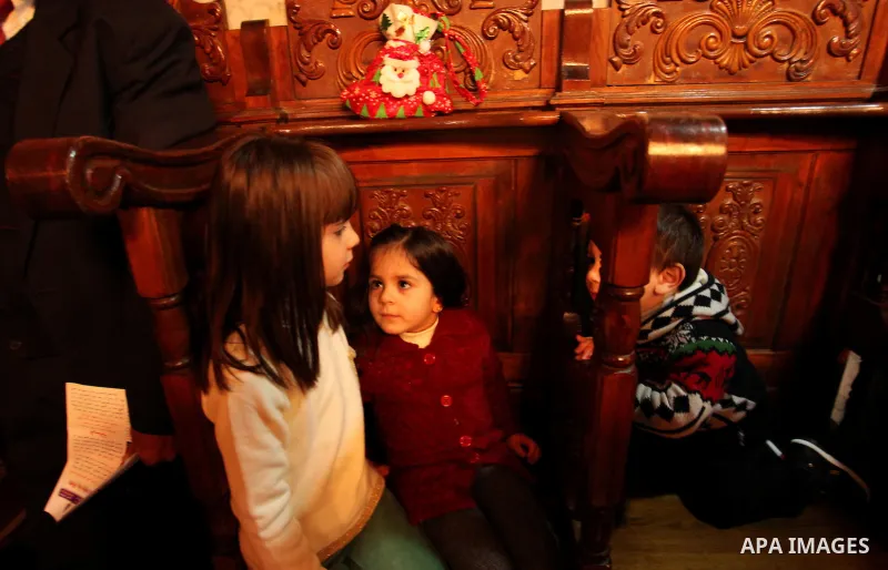 Palestinian Orthodox Christian altar boys attend a Christmas mass at the Saint Porphyrios Greek Orthodox church in Gaza City on January 7, 2017. According to the Gregorian calendar, Orthodox Christmas falls 13 days after...