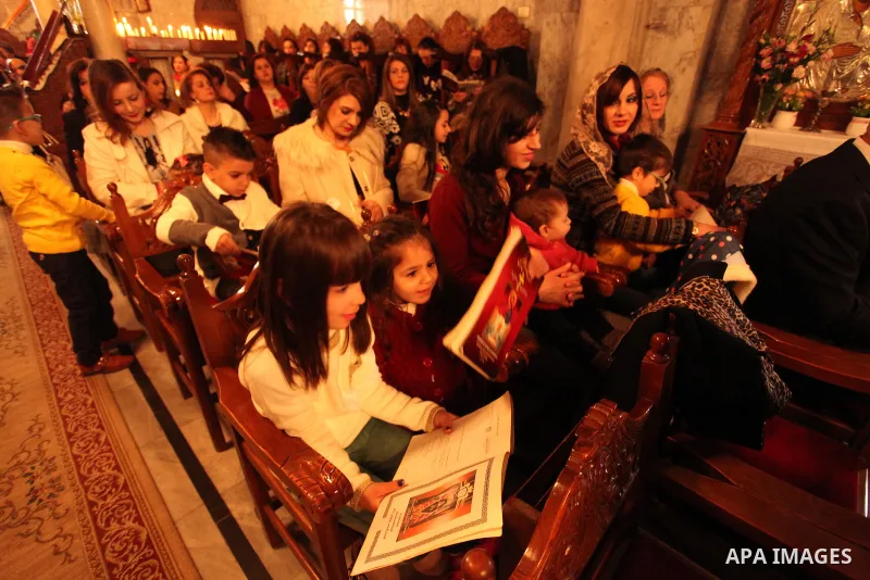 Palestinian Orthodox Christian altar boys attend a Christmas mass at the Saint Porphyrios Greek Orthodox church in Gaza City on January 7, 2017. According to the Gregorian calendar, Orthodox Christmas falls 13 days after...