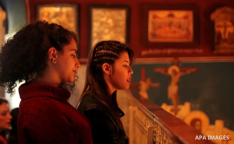 Palestinian Orthodox Christian altar boys attend a Christmas mass at the Saint Porphyrios Greek Orthodox church in Gaza City on January 7, 2017. According to the Gregorian calendar, Orthodox Christmas falls 13 days after...