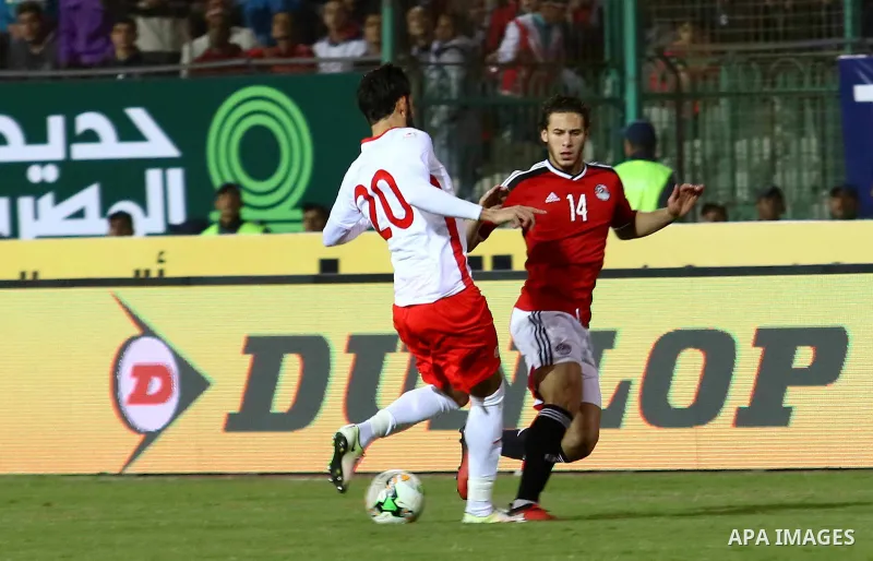 Egypt players and Tunisia players compete during an international friendly football match at the Cairo International Stadium in the Egyptian capital on January 8, 2017. Photo by Stringer