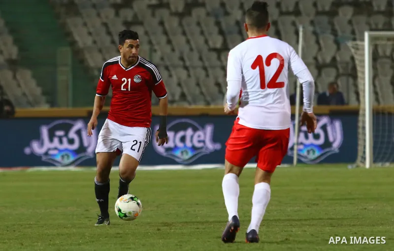 Egypt players and Tunisia players compete during an international friendly football match at the Cairo International Stadium in the Egyptian capital on January 8, 2017. Photo by Stringer