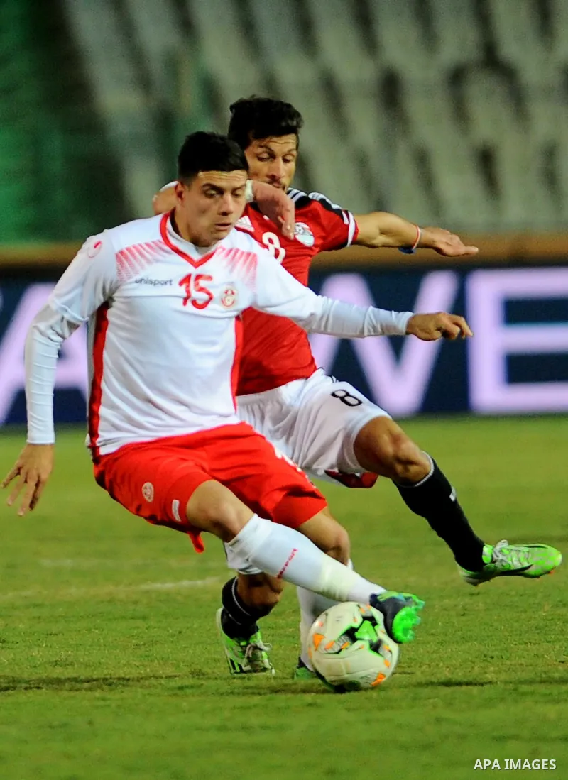 Egypt players and Tunisia players compete during an international friendly football match at the Cairo International Stadium in the Egyptian capital on January 8, 2017. Photo by Stringer