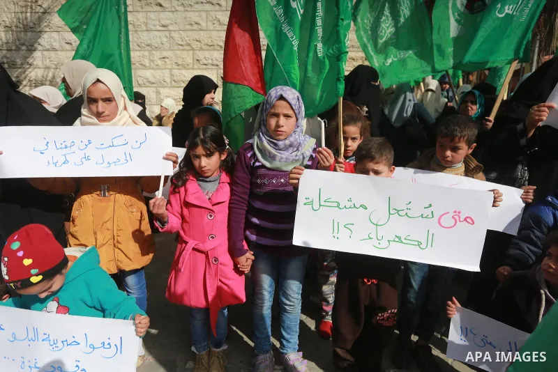 Palestinian children take part in a protest against power cut in Gaza city, on January 10, 2017. The power plant has not run at full capacity in years, with Israel's crippling blockade severely limiting fuel imports into...