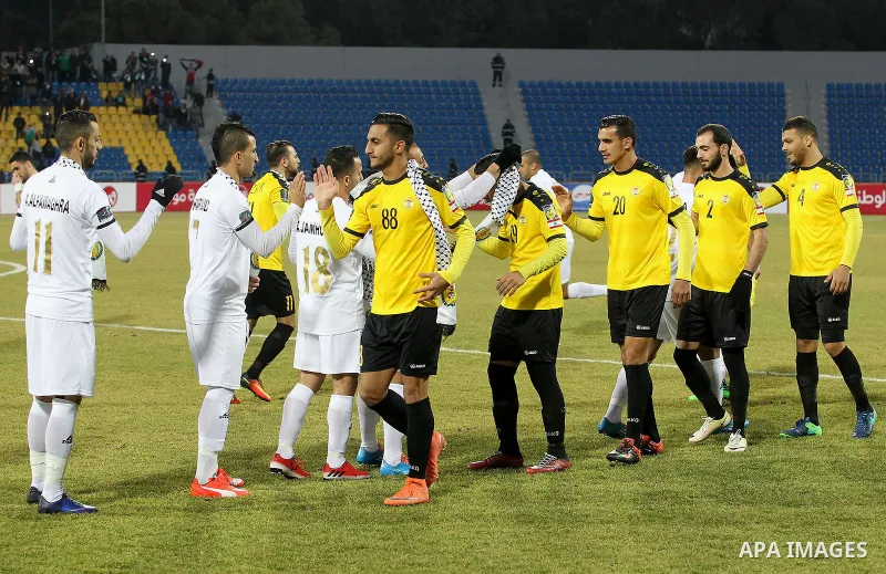 Palestinian players of Shabab Hebron and Players of Lebanese al-Ahed FC compete during their a second leg match of Arab championship for clubs at Amman international stadium, in Amman, Jordan, on January 12, 2017. Photo...