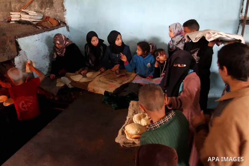 A Palestinian baker makes bread using a wood-fired oven at his traditional bakery in Rafah in the southern Gaza strip, on January 14, 2017. Power shortages in the Palestinian enclave have occurred repeatedly in recent we...