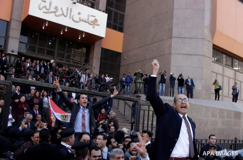 Egyptian lawyer and former presidential candidate Khaled Ali celebrates after the Supreme Administrative Court upheld on January 16, 2017 a ruling voiding a government agreement to hand over two Red Sea islands Tiran and...