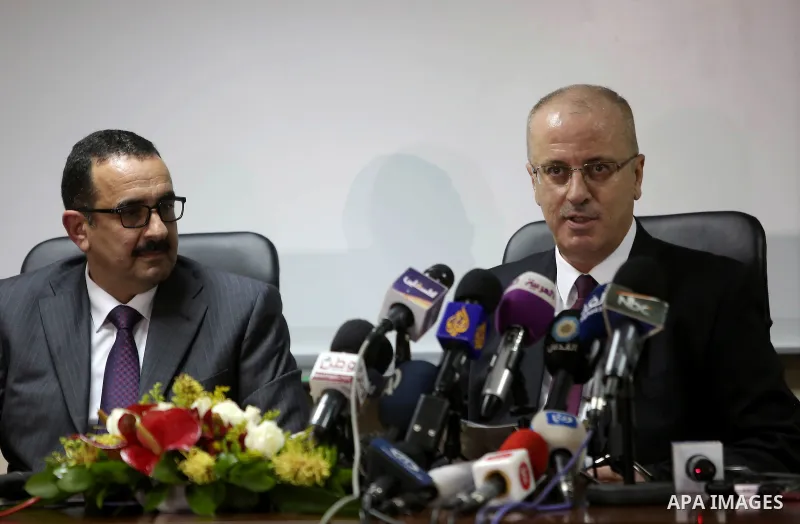Palestinian Prime Minister Rami Hamdallah speaks during a press conference about the power crisis in the Gaza Strip in the West Bank city of Ramallah on January 16, 2017. Gaza's power authority said that fuel from Qatar...