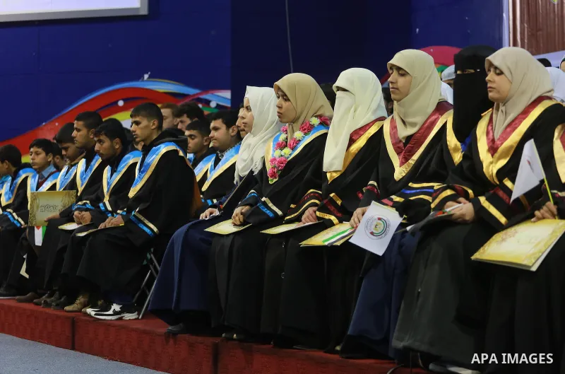 Palestinian students participate during the ceremony honoring the Holy Koran at the Islamic University in Gaza City on January 18, 2017. Photo by Mohammed Asad