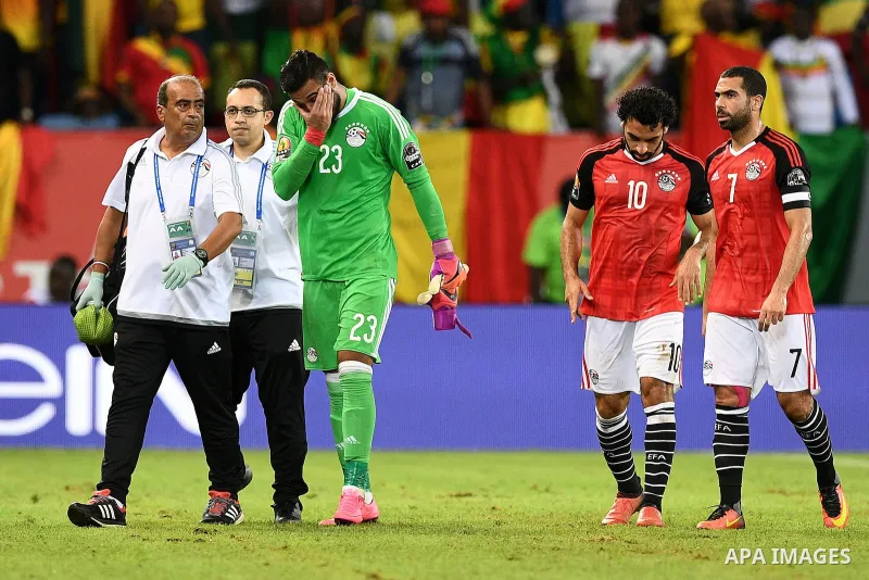 Egypt's goalkeeper Ahmed El-Shenawy reacts as he walks off the pitch due to an injury during the 2017 Africa Cup of Nations group D football match between Mali and Egypt in Port-Gentil on January 17, 2017. Photo by Stran...
