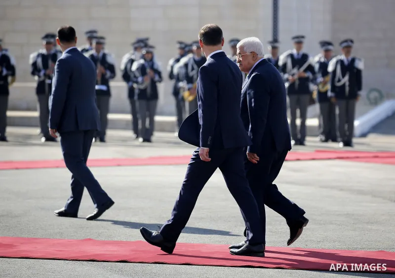 Palestinian President Mahmoud Abbas walks alongside the Polish President Andrzej Duda before a meeting in the West Bank town of Bethlehem January 18, 2017. Photo by Wisam Hashlamoun