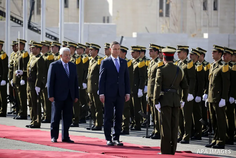 Palestinian president Mahmoud Abbas and Polish President Andrzej Duda review the honour guard upon the latter's visit to the West Bank town of Bethlehem on January 18, 2017. Photo by Wisam Hashlamoun