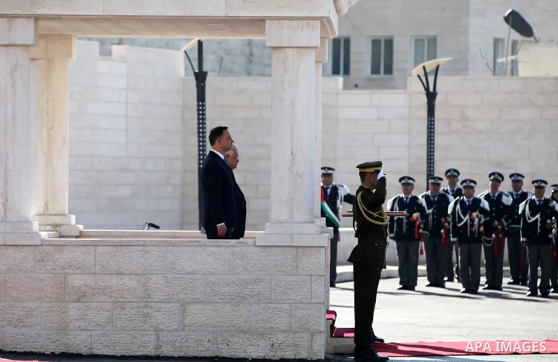 Palestinian president Mahmoud Abbas and Polish President Andrzej Duda review the honour guard upon the latter's visit to the West Bank town of Bethlehem on January 18, 2017. Photo by Wisam Hashlamoun