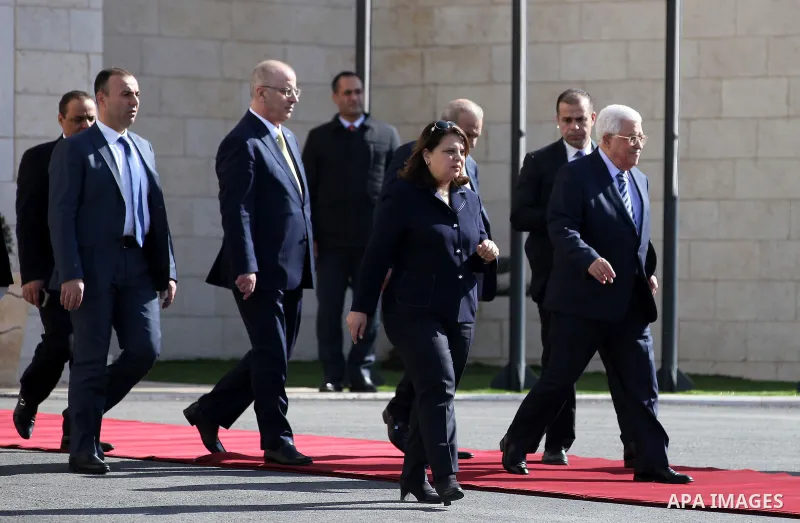 Palestinian President Mahmoud Abbas and Palestinian Prime Minister Rami Hamdallah arrive to welcome Polish President Andrzej Duda (not seen) in the West Bank town of Bethlehem January 18, 2017. Photo by Wisam Hashlamoun