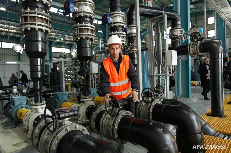 A Palestinian worker checks of pipes during the inauguration ceremony of The First Phase of the Seawater Desalination Plant-Southern Gaza completed with generous support from the European union Implemented by UNICEF in p...