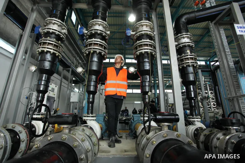 A Palestinian worker checks of pipes during the inauguration ceremony of The First Phase of the Seawater Desalination Plant-Southern Gaza completed with generous support from the European union Implemented by UNICEF in p...
