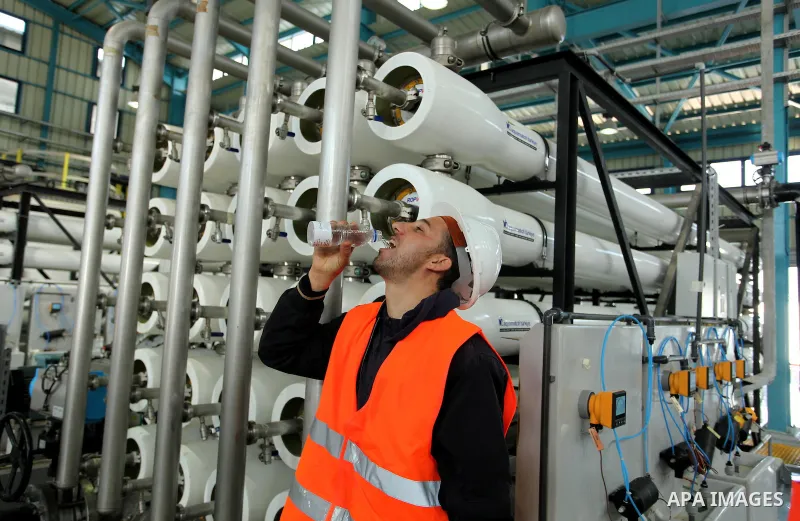 A Palestinian worker drinks water extracted form the First Phase of the Seawater Desalination Plant-Southern Gaza completed with generous support from the European union Implemented by UNICEF in partnership with Palestin...