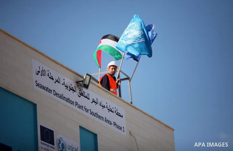 A Palestinian worker looks on during the inauguration ceremony of The First Phase of the Seawater Desalination Plant-Southern Gaza completed with generous support from the European union Implemented by UNICEF in partners...