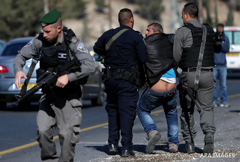Israeli police detain a Palestinian protester during a demonstration against the construction of Jewish settlements in the occupied West Bank and against US President-elect Donald Trump, on January 20, 2017, near the set...