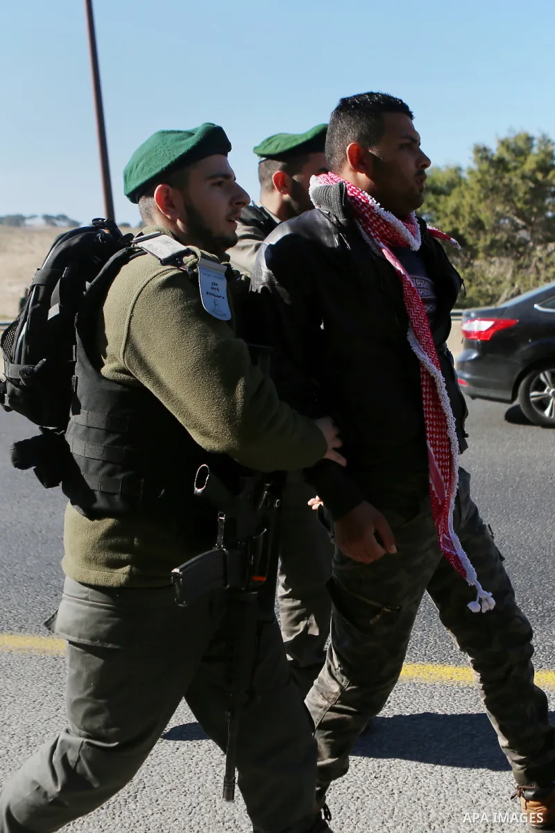 Israeli police detain a Palestinian protester during a demonstration against the construction of Jewish settlements in the occupied West Bank and against US President-elect Donald Trump, on January 20, 2017, near the set...