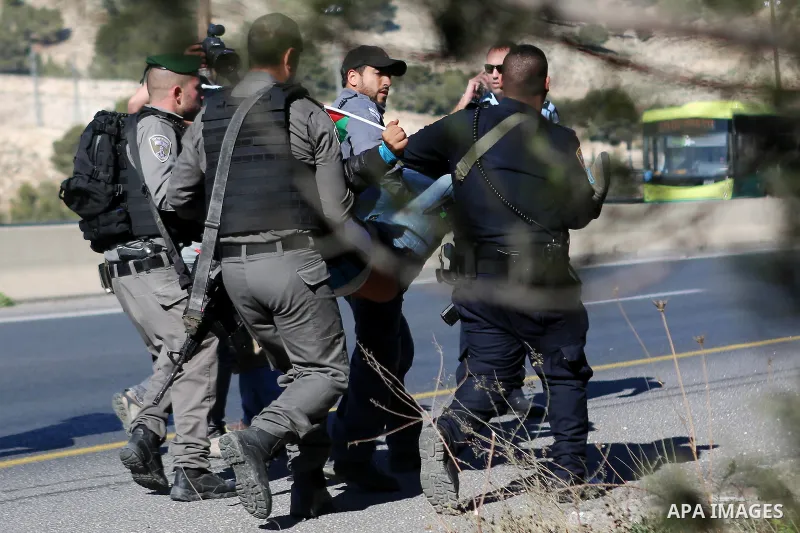 Israeli police detain a Palestinian protester during a demonstration against the construction of Jewish settlements in the occupied West Bank and against US President-elect Donald Trump, on January 20, 2017, near the set...