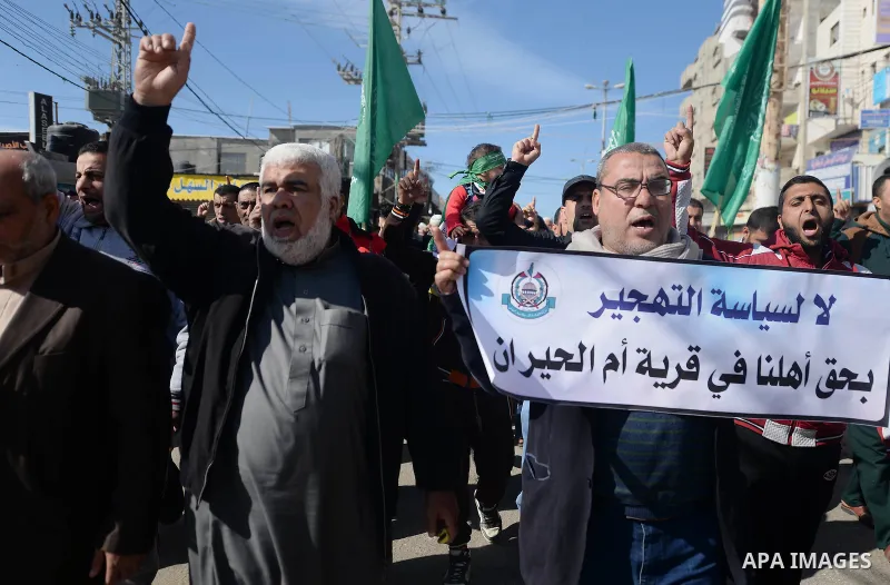 Palestinians hold placards during a protest against proposed plans by President-elect Donald Trump to move the US embassy in Israel to Jerusalem, and against the power crisis, and to show solidarity with Palestinian in B...
