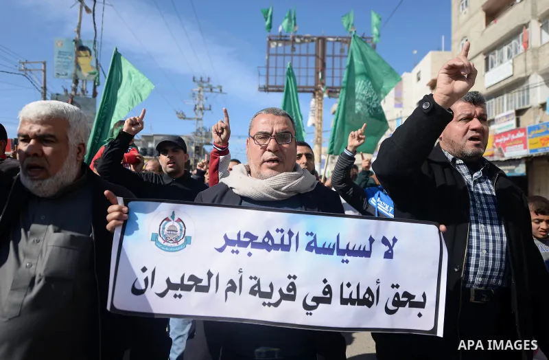Palestinians hold placards during a protest against proposed plans by President-elect Donald Trump to move the US embassy in Israel to Jerusalem, and against the power crisis, and to show solidarity with Palestinian in B...
