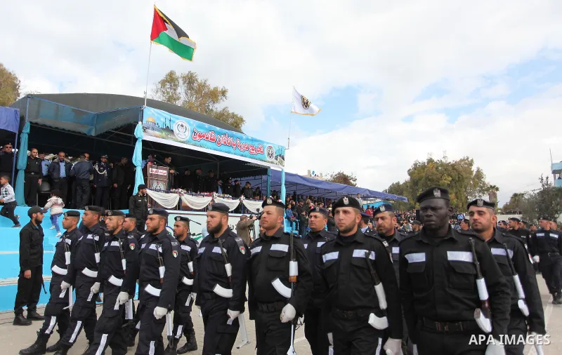 Palestinian policemen march during a graduation ceremony in Gaza City on January 21, 2017. Photo by Ashraf Amra