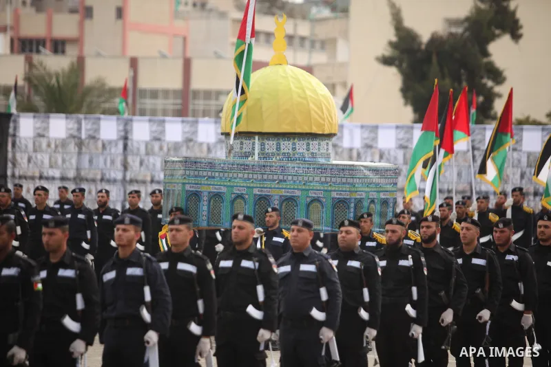 Palestinian policemen march during a graduation ceremony in Gaza City on January 21, 2017. Photo by Ashraf Amra