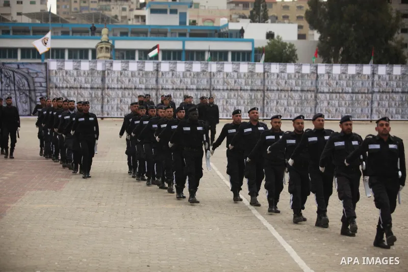 Palestinian policemen march during a graduation ceremony in Gaza City on January 21, 2017. Photo by Ashraf Amra