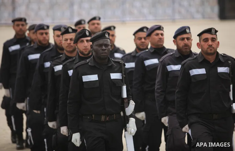 Palestinian policemen march during a graduation ceremony in Gaza City on January 21, 2017. Photo by Ashraf Amra