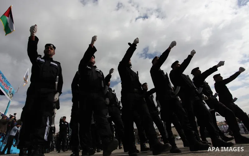 Palestinian policemen march during a graduation ceremony in Gaza City on January 21, 2017. Photo by Ashraf Amra